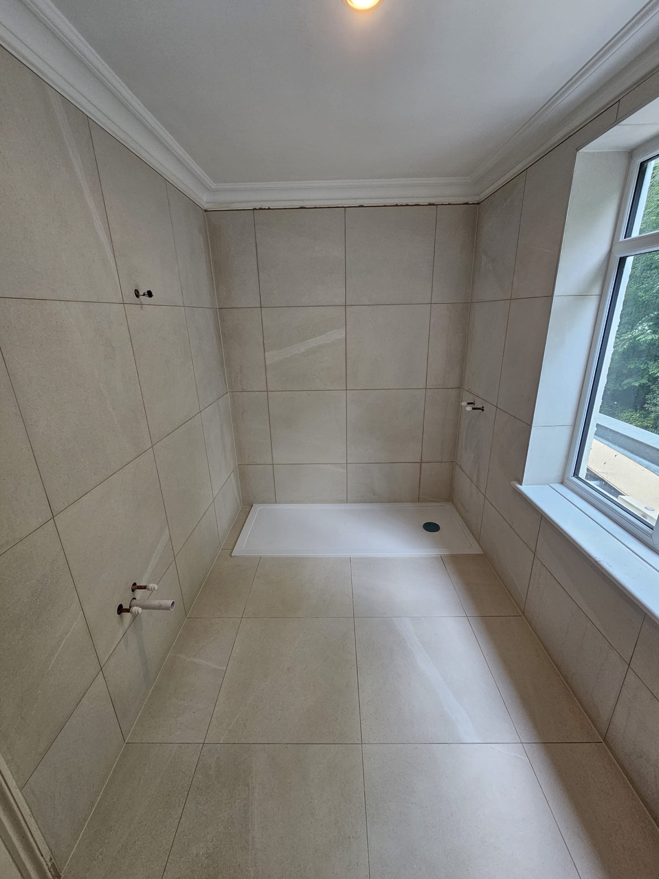 Bathroom shower wall and floor tiling with shower tray installed by Samson Handyman